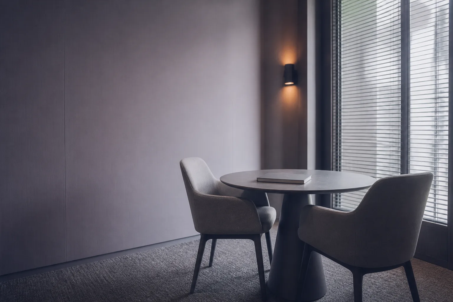 A consultation room already set up for the day, two chairs facing each other across a small table — an AI sales team that arrives shaped by the playbook you already run.